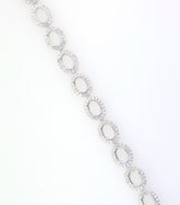 Sterling Silver Semi Mount Tennis Bracelet Setting with oval halos and white topaz inlay, elegant design for custom sizing.